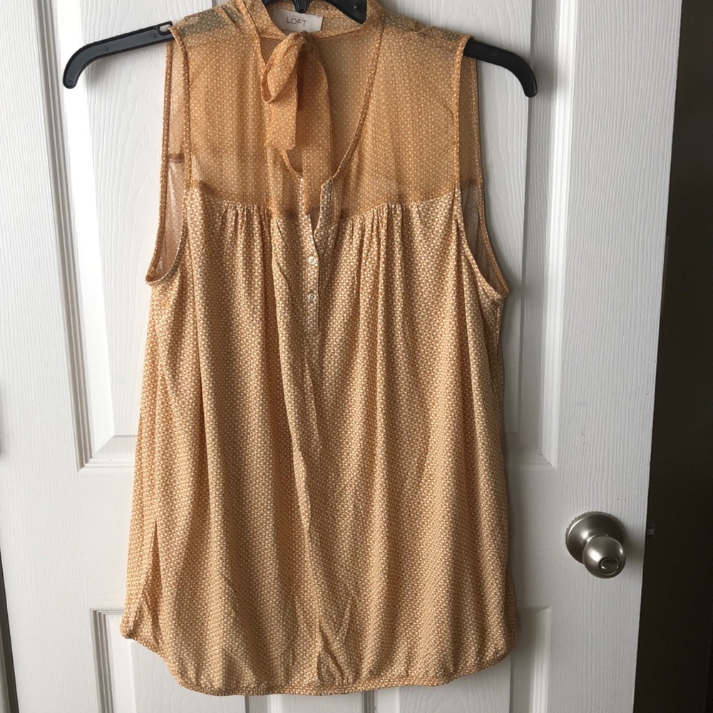 Loft Sleeveless Blouse with banded bottom.